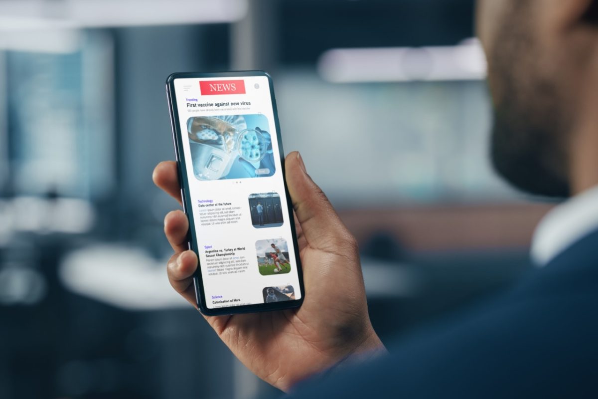 A man checking the news on his smartphone.