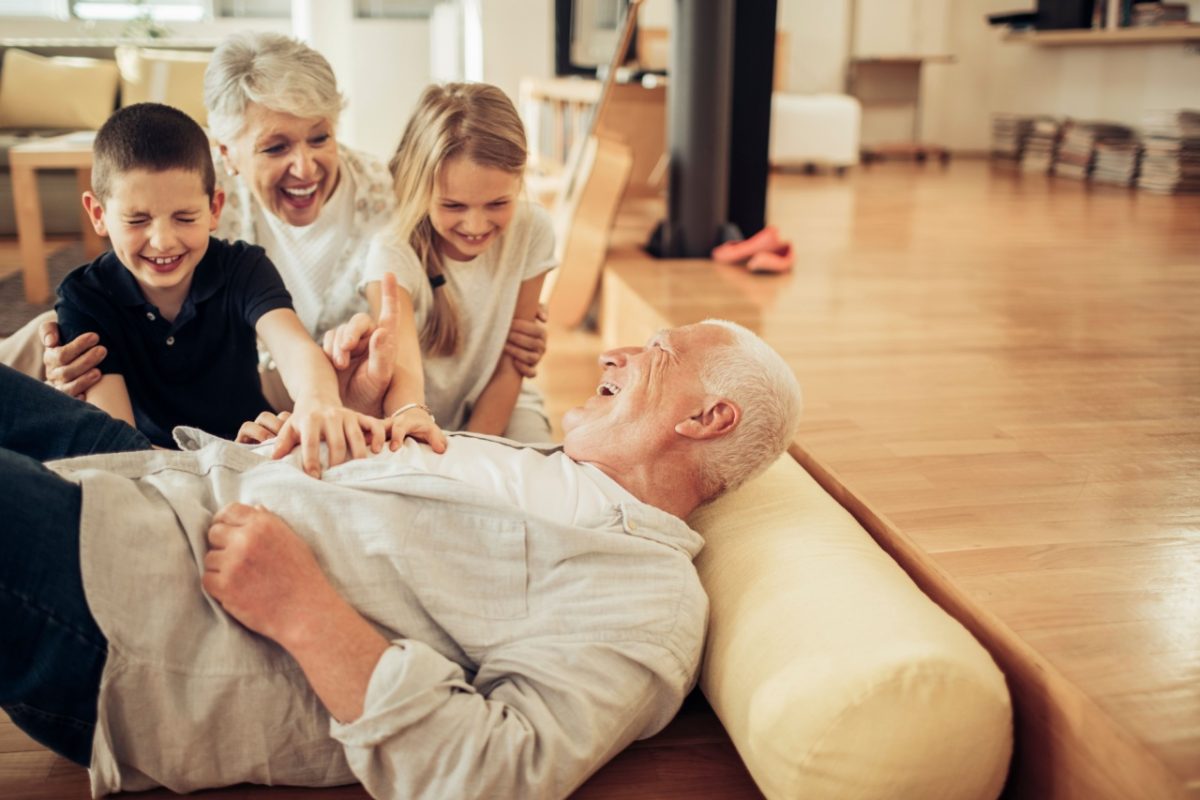 Grandparents playing with their grandchildren.